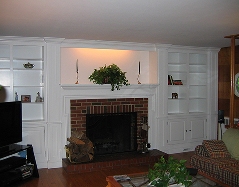 Painted Fireplace surrounded with wall units